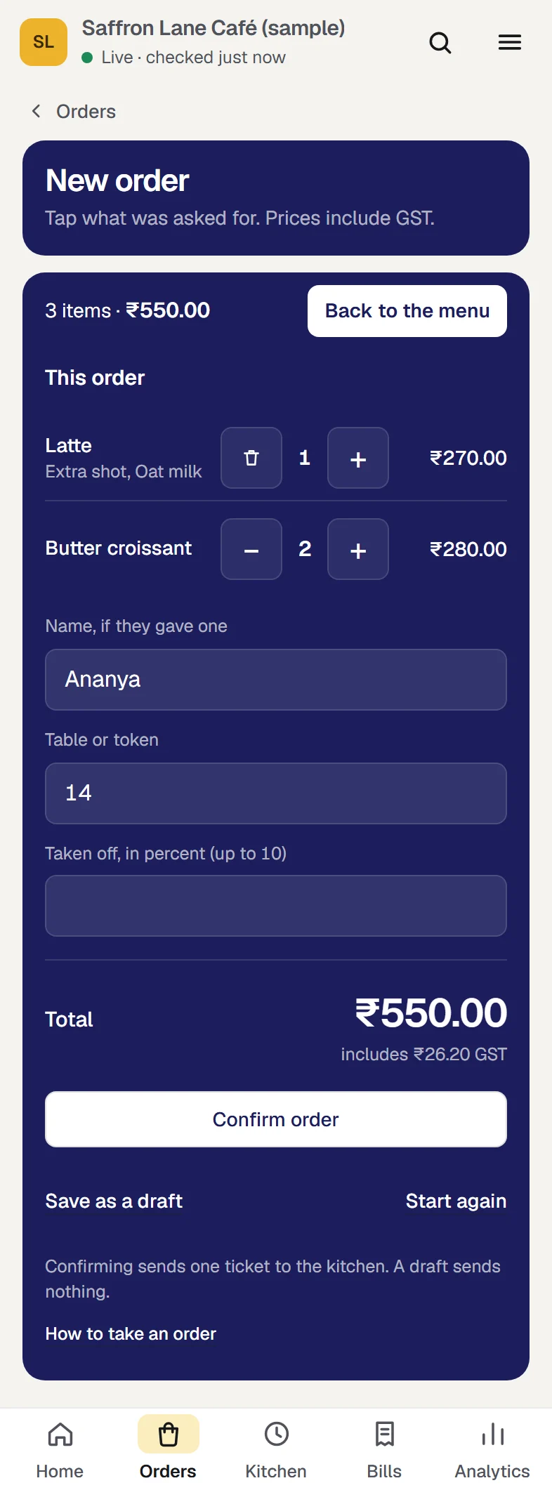 The same order on a phone, opened with See the order. The bar now offers Back to the menu. This order lists the Latte with Extra shot and Oat milk at ₹270.00 and two Butter croissants at ₹280.00, then Name, if they gave one, Table or token, the Total of ₹550.00 including ₹26.20 GST, Confirm order, Save as a draft and Start again.