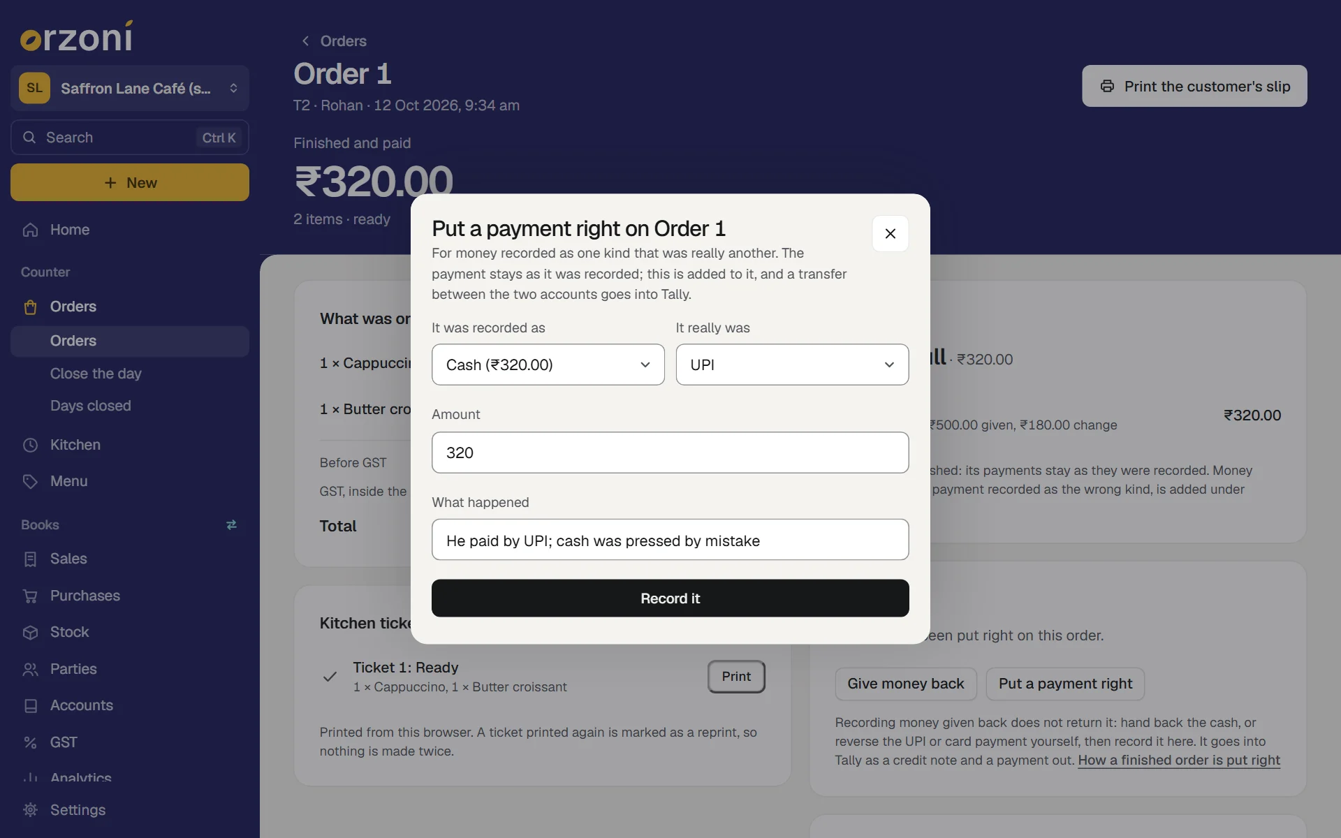 The sheet Put a payment right on Order 1, for the made-up Saffron Lane Café (sample), an order of ₹320.00 paid in cash. Its first lines say it is for money recorded as one kind that was really another, that the payment stays as it was recorded, and that a transfer between the two accounts goes into Tally. It was recorded as: Cash (₹320.00). It really was: UPI. Amount is 320, and What happened reads He paid by UPI; cash was pressed by mistake, above the button Record it.